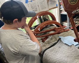 1917 Reading Standard Model T-E 12 HP Twin 2024-06-16 0565 Ryker inspecting newly painted parts.